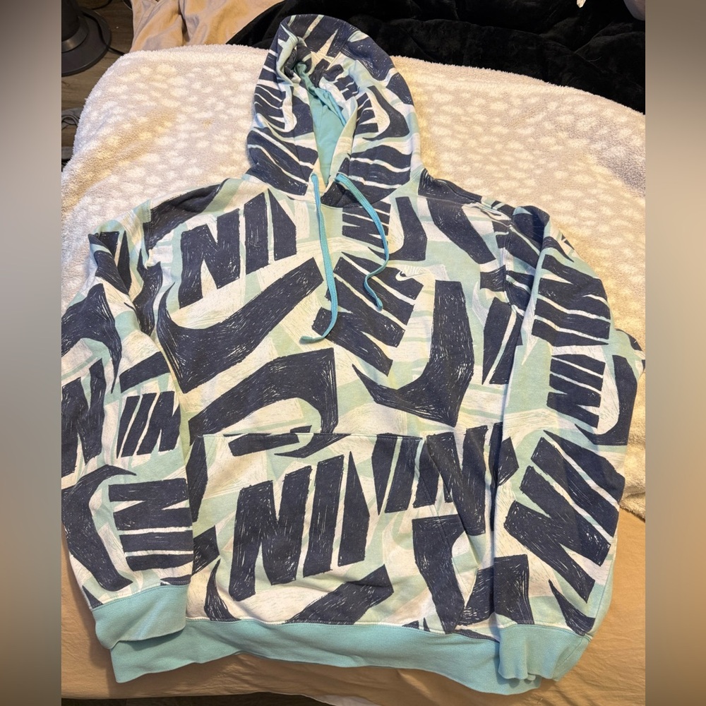 Nike Sweatshirt. Not sure on size fits like Medium. Blue color.